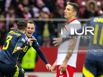 Andy Robertson (L) and Lawrence Shankland celebrate scoring a winning goal during the  UEFA Nations League 2024 League A Group A1 match betw...