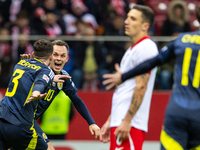 Andy Robertson (L) and Lawrence Shankland celebrate scoring a winning goal during the  UEFA Nations League 2024 League A Group A1 match betw...