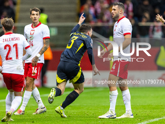 Andy Robertson (C)  celebrates scoring the winning goal during the  UEFA Nations League 2024 League A Group A1 match between Poland and Scot...