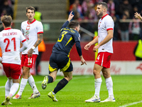 Andy Robertson (C)  celebrates scoring the winning goal during the  UEFA Nations League 2024 League A Group A1 match between Poland and Scot...