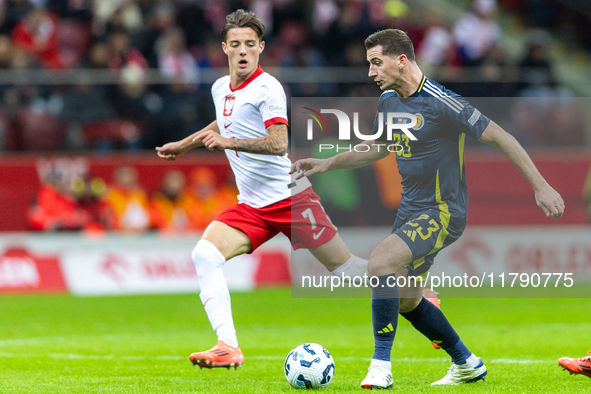 Kacper Urbanski and Kenny McLean during the  UEFA Nations League 2024 League A Group A1 match between Poland and Scotland, at the  PGE Narod...