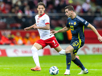 Kacper Urbanski and Kenny McLean during the  UEFA Nations League 2024 League A Group A1 match between Poland and Scotland, at the  PGE Narod...