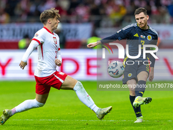 Nicola Zalewski and Andy Robertson during the  UEFA Nations League 2024 League A Group A1 match between Poland and Scotland, at the  PGE Nar...