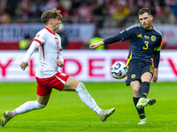 Nicola Zalewski and Andy Robertson during the  UEFA Nations League 2024 League A Group A1 match between Poland and Scotland, at the  PGE Nar...