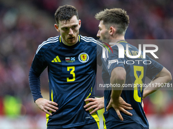 Andy Robertson and Billy Gilmour  talk during the  UEFA Nations League 2024 League A Group A1 match between Poland and Scotland, at the  PGE...