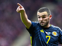 John McGinn reacts during the  UEFA Nations League 2024 League A Group A1 match between Poland and Scotland, at the  PGE Narodowy in Warsaw,...