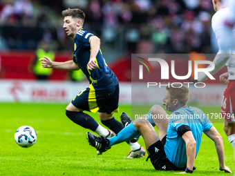 Referee Christian Dingert  falls  during the  UEFA Nations League 2024 League A Group A1 match between Poland and Scotland, at the  PGE Naro...