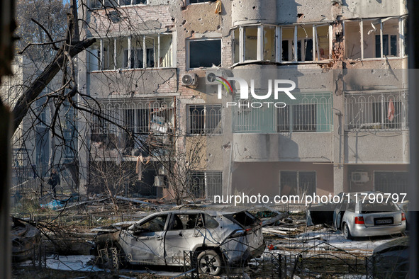 Mutilated cars are seen outside a residential building damaged by Russian rocket fire in Odesa, Ukraine, on November 18, 2024. NO USE RUSSIA...