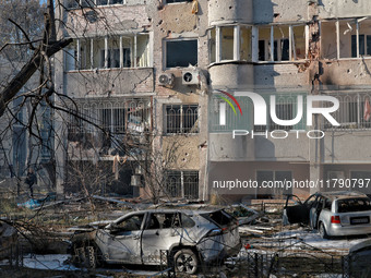 Mutilated cars are seen outside a residential building damaged by Russian rocket fire in Odesa, Ukraine, on November 18, 2024. NO USE RUSSIA...