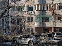 Mutilated cars are seen outside a residential building damaged by Russian rocket fire in Odesa, Ukraine, on November 18, 2024. NO USE RUSSIA...