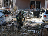 A rescuer stands next to the cars damaged by a Russian missile strike in Odesa, Ukraine, on November 18, 2024. NO USE RUSSIA. NO USE BELARUS...