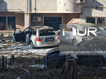 A rescuer stands next to the cars damaged by Russian rocket fire in Odesa, Ukraine, on November 18, 2024. NO USE RUSSIA. NO USE BELARUS. (