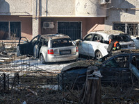 A rescuer stands next to the cars damaged by Russian rocket fire in Odesa, Ukraine, on November 18, 2024. NO USE RUSSIA. NO USE BELARUS. (