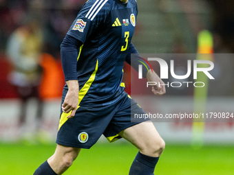 Andy Robertson in action during the  UEFA Nations League 2024 League A Group A1 match between Poland and Scotland, at the  PGE Narodowy in W...