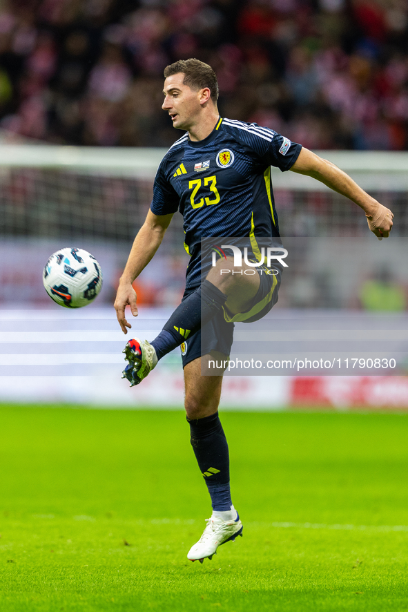 Kenny McLean in action during the  UEFA Nations League 2024 League A Group A1 match between Poland and Scotland, at the  PGE Narodowy in War...