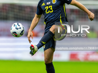 Kenny McLean in action during the  UEFA Nations League 2024 League A Group A1 match between Poland and Scotland, at the  PGE Narodowy in War...