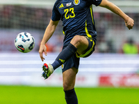 Kenny McLean in action during the  UEFA Nations League 2024 League A Group A1 match between Poland and Scotland, at the  PGE Narodowy in War...