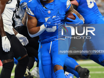 DETROIT,MICHIGAN-November 17: Detroit Lions running back David Montgomery (5) scores a touchdown during the first half of an NFL football ga...