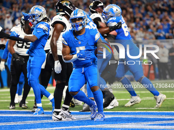 DETROIT,MICHIGAN-November 17: Detroit Lions running back David Montgomery (5) scores a touchdown during the first half of an NFL football ga...