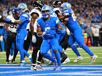 DETROIT,MICHIGAN-November 17: Detroit Lions running back David Montgomery (5) scores a touchdown during the first half of an NFL football ga...