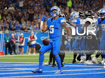 DETROIT,MICHIGAN-November 17: Detroit Lions running back David Montgomery (5) reacts after scoring a touchdown during the first half of an N...