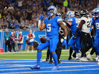 DETROIT,MICHIGAN-November 17: Detroit Lions running back David Montgomery (5) reacts after scoring a touchdown during the first half of an N...