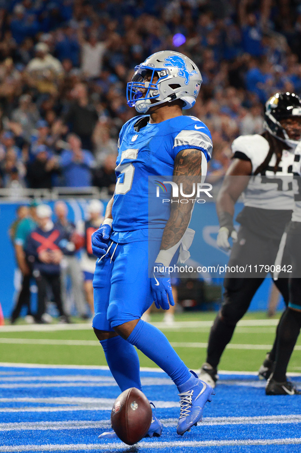 DETROIT,MICHIGAN-November 17: Detroit Lions running back David Montgomery (5) reacts after scoring a touchdown during the first half of an N...