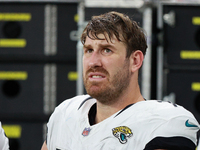 DETROIT,MICHIGAN-November 17: Jacksonville Jaguars offensive tackle Walker Little (72) is seen on the sideline during the first half of an N...