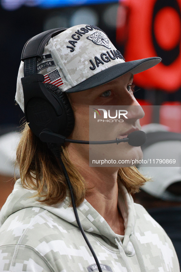 DETROIT,MICHIGAN-November 17: Jacksonville Jaguars quarterback Trevor Lawrence (16) looks on from the sideline during the first half of an N...