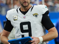 DETROIT,MICHIGAN-November 17: Jacksonville Jaguars punter Logan Cooke (9) looks on during the first half of an NFL football game between the...