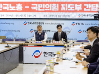 Han Dong-hoon, leader of the People Power Party, and Kim Dong-myung, chairman of the Korean Federation of Trade Unions, hold a meeting at th...