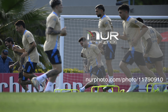 In Ezeiza, Buenos Aires, on November 18, 2024, Lionel Messi, a player of the Argentina National Team, jogs alongside his teammates during a...