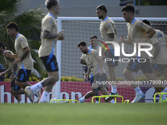 In Ezeiza, Buenos Aires, on November 18, 2024, Lionel Messi, a player of the Argentina National Team, jogs alongside his teammates during a...