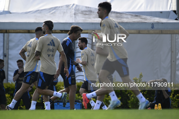 In Ezeiza, Buenos Aires, on November 18, 2024, Lionel Messi, a player of the Argentina National Team, jogs alongside his teammates during a...