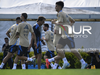 In Ezeiza, Buenos Aires, on November 18, 2024, Lionel Messi, a player of the Argentina National Team, jogs alongside his teammates during a...