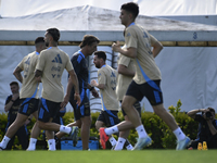 In Ezeiza, Buenos Aires, on November 18, 2024, Lionel Messi, a player of the Argentina National Team, jogs alongside his teammates during a...