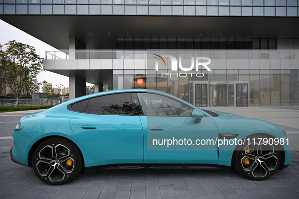 A Xiaomi car is seen at the entrance of the East China headquarters building of Xiaomi Group in Nanjing, China, on November 19, 2024. Xiaomi...