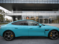 A Xiaomi car is seen at the entrance of the East China headquarters building of Xiaomi Group in Nanjing, China, on November 19, 2024. Xiaomi...