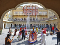 Tourists dance with Rajasthani folk artists at the historical Hawa Mahal on the occasion of the 297th Foundation of 'Pinkcity' in Jaipur, Ra...