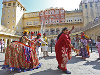 Tourists dance with Rajasthani folk artists at the historical Hawa Mahal on the occasion of the 297th Foundation of 'Pinkcity' in Jaipur, Ra...