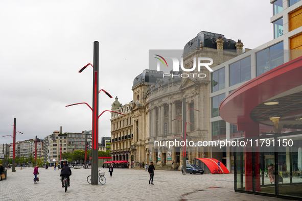 This scene shows people navigating the vibrant square outside the Opera Metro Station in Antwerp, Belgium, on July 31, 2023. Pedestrians and...