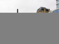 This scene shows people navigating the vibrant square outside the Opera Metro Station in Antwerp, Belgium, on July 31, 2023. Pedestrians and...