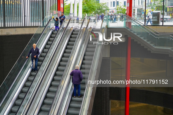 The entrance to Antwerp Opera Metro Station in Antwerp, Belgium, on July 31, 2023, shows commuters and locals moving in and out of the stati...