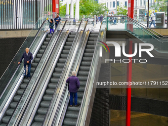 The entrance to Antwerp Opera Metro Station in Antwerp, Belgium, on July 31, 2023, shows commuters and locals moving in and out of the stati...