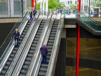 The entrance to Antwerp Opera Metro Station in Antwerp, Belgium, on July 31, 2023, shows commuters and locals moving in and out of the stati...