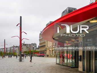 This scene shows people navigating the vibrant square outside the Opera Metro Station in Antwerp, Belgium, on July 31, 2023. Pedestrians mov...