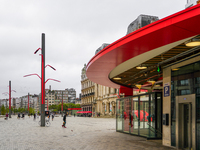 This scene shows people navigating the vibrant square outside the Opera Metro Station in Antwerp, Belgium, on July 31, 2023. Pedestrians mov...