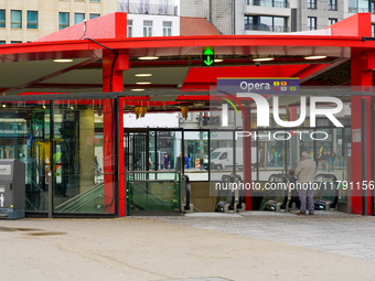 A man stands near the escalators at the entrance of Antwerp's Opera Metro Station in Antwerp, Belgium, on July 31, 2023. The station serves...