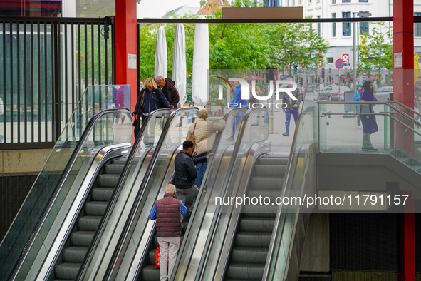 The entrance to Antwerp Opera Metro Station in Antwerp, Belgium, on July 31, 2023, shows commuters and locals moving in and out of the stati...