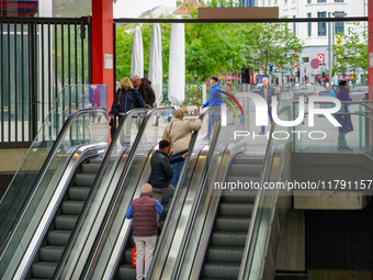 The entrance to Antwerp Opera Metro Station in Antwerp, Belgium, on July 31, 2023, shows commuters and locals moving in and out of the stati...